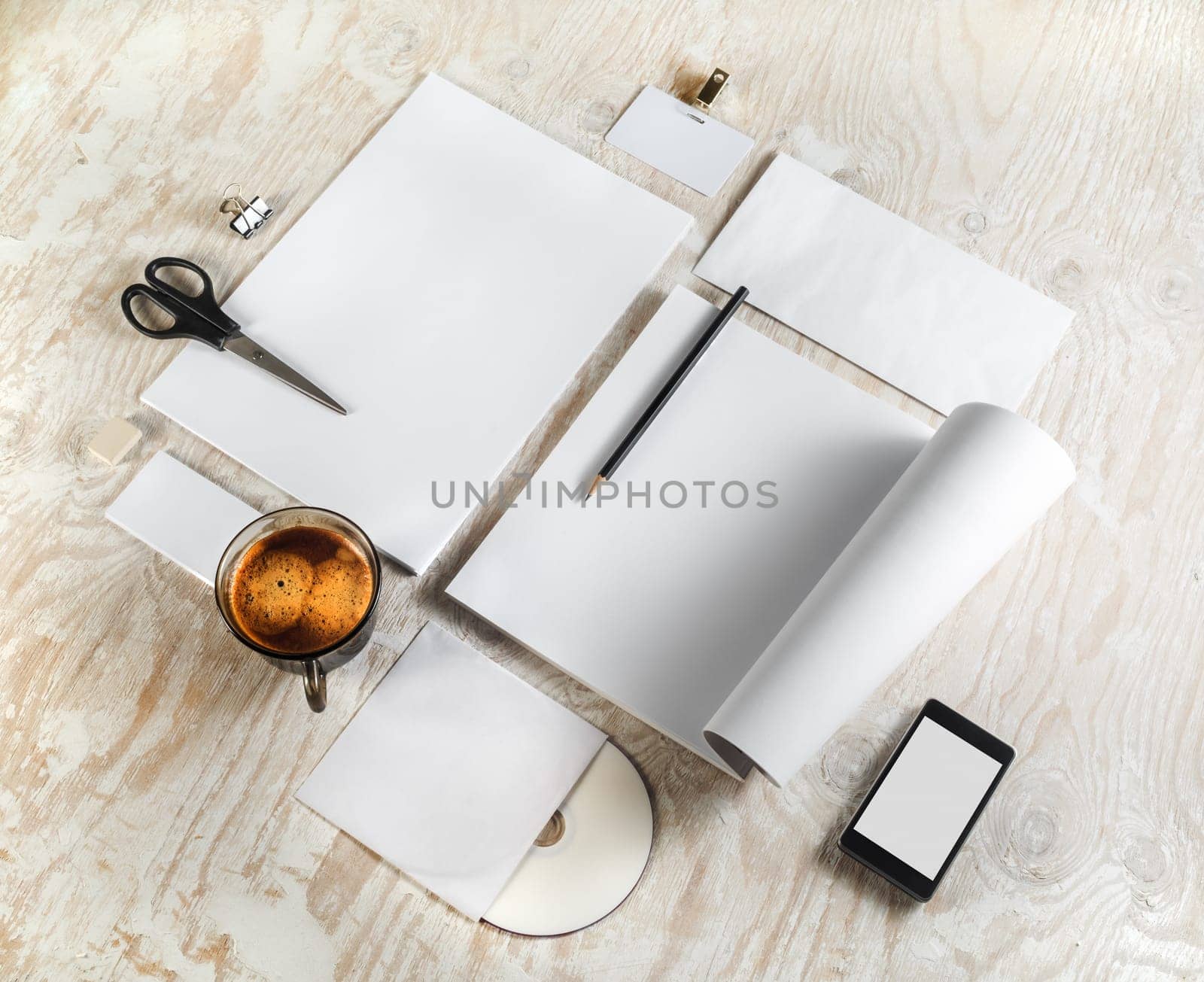 Corporate identity template on light wooden background. For design presentations and portfolios. Top view.