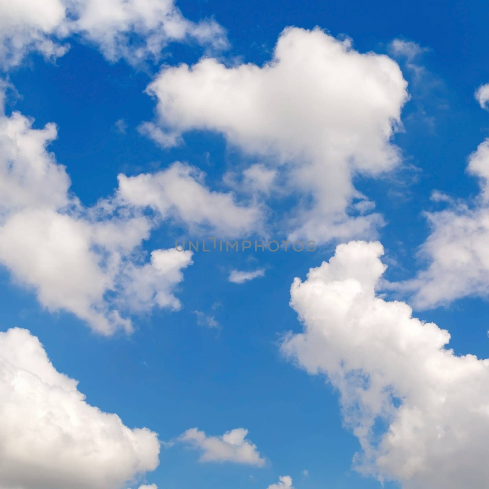 Photo of blue sky with white clouds.