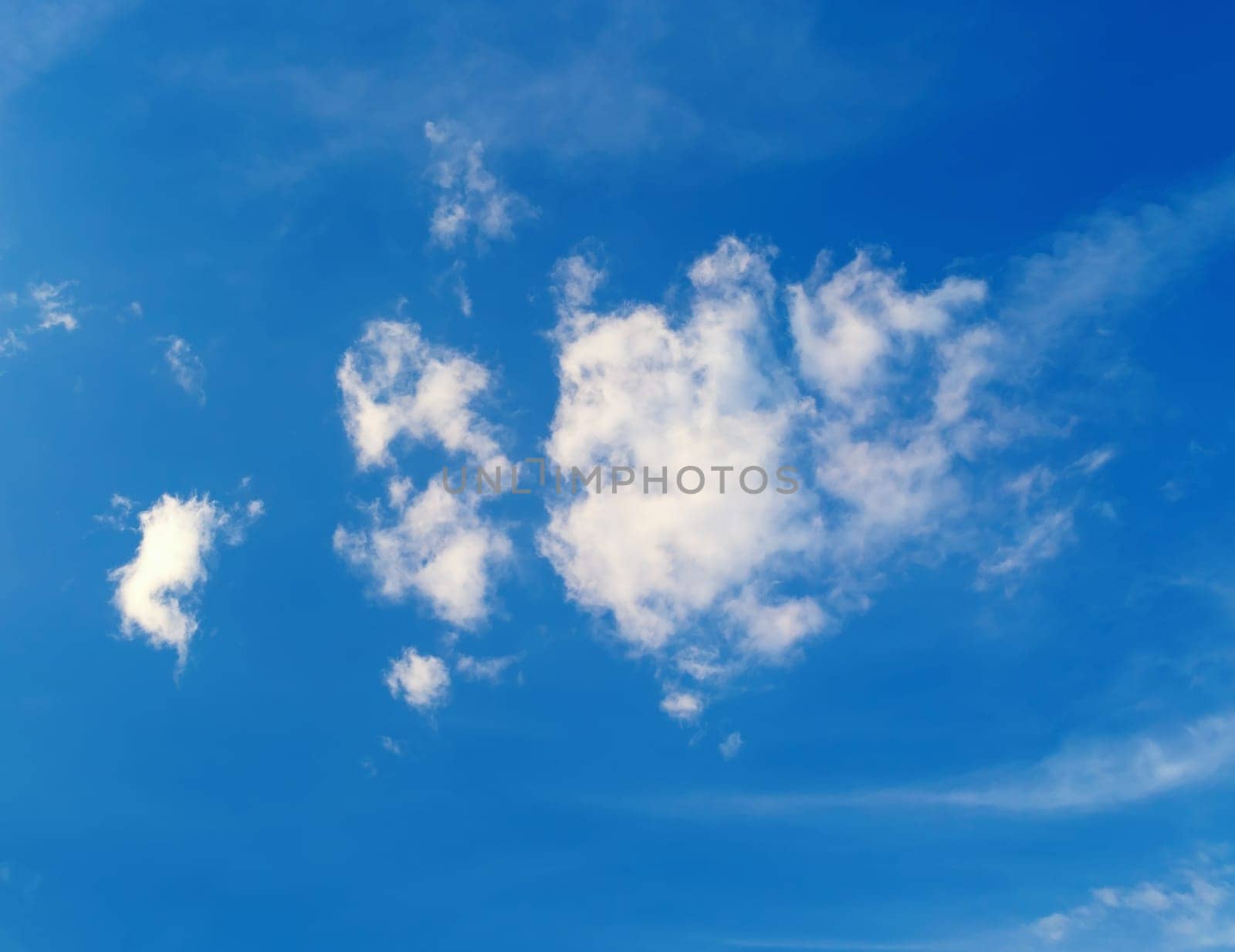 White cloud in the blue sky background. Sunny summer day.