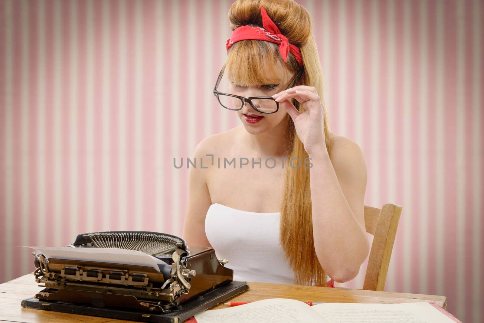 sexy young pinup girl with old typewriter