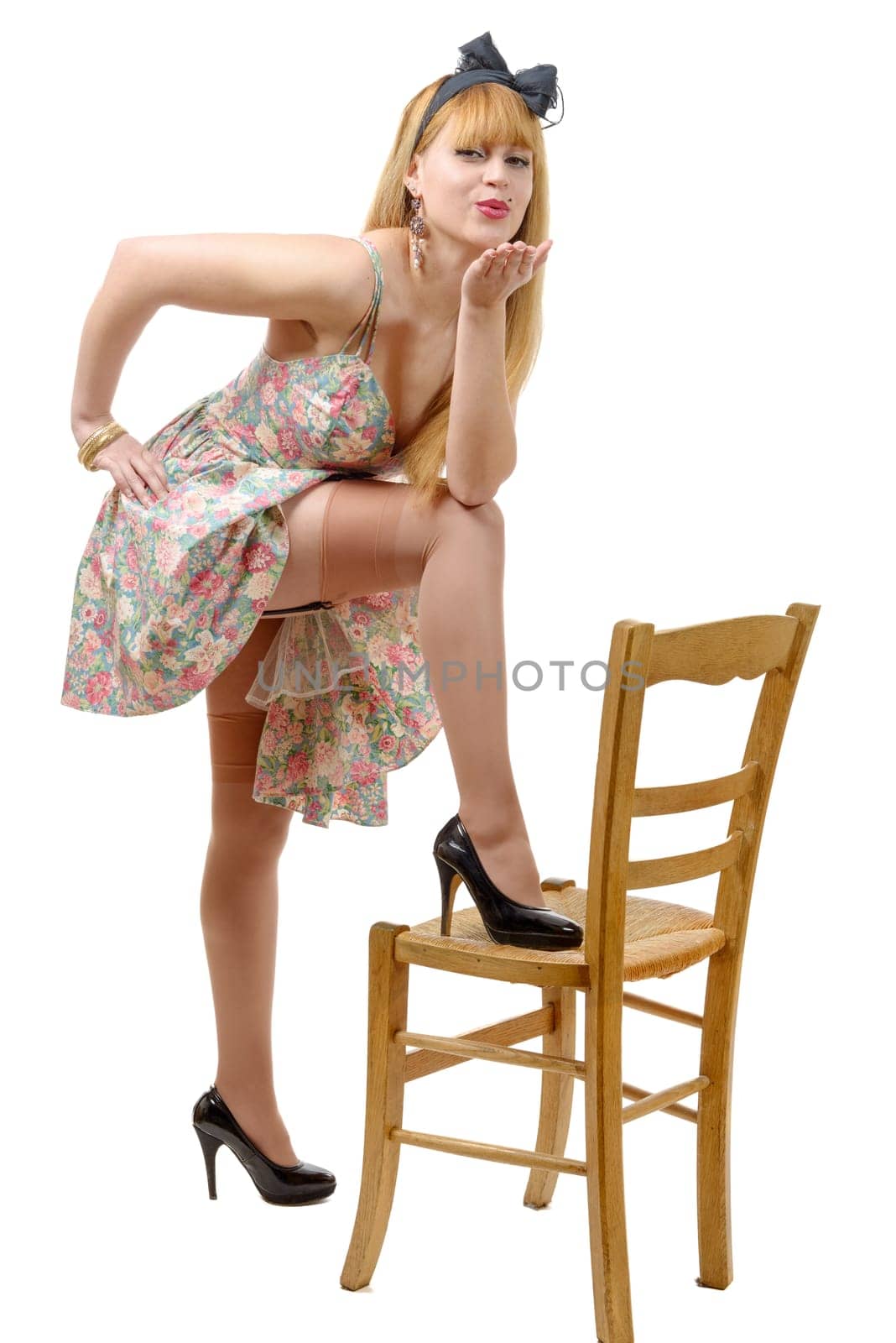 pretty pinup girl sending kisses on the white background