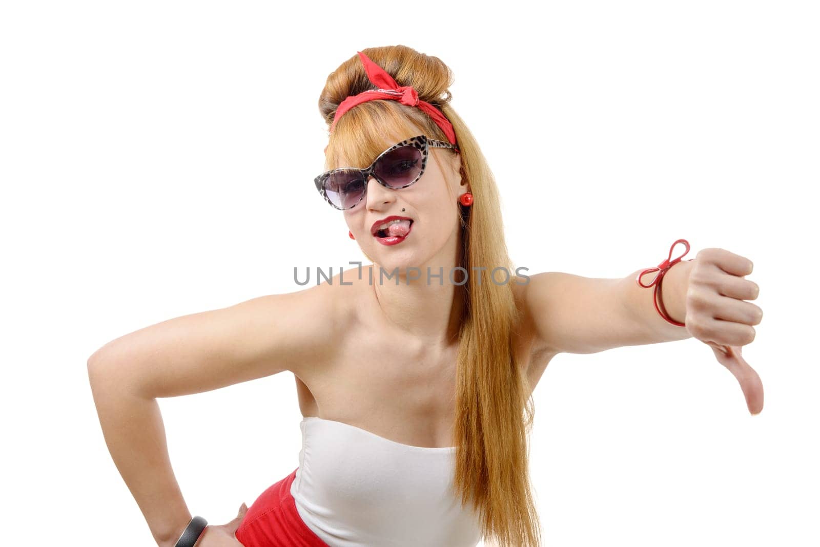 Pretty girl pin-up with the thumb down isolated on white background
