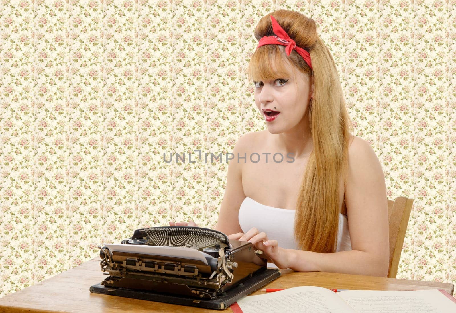 sexy young pinup girl with old typewriter