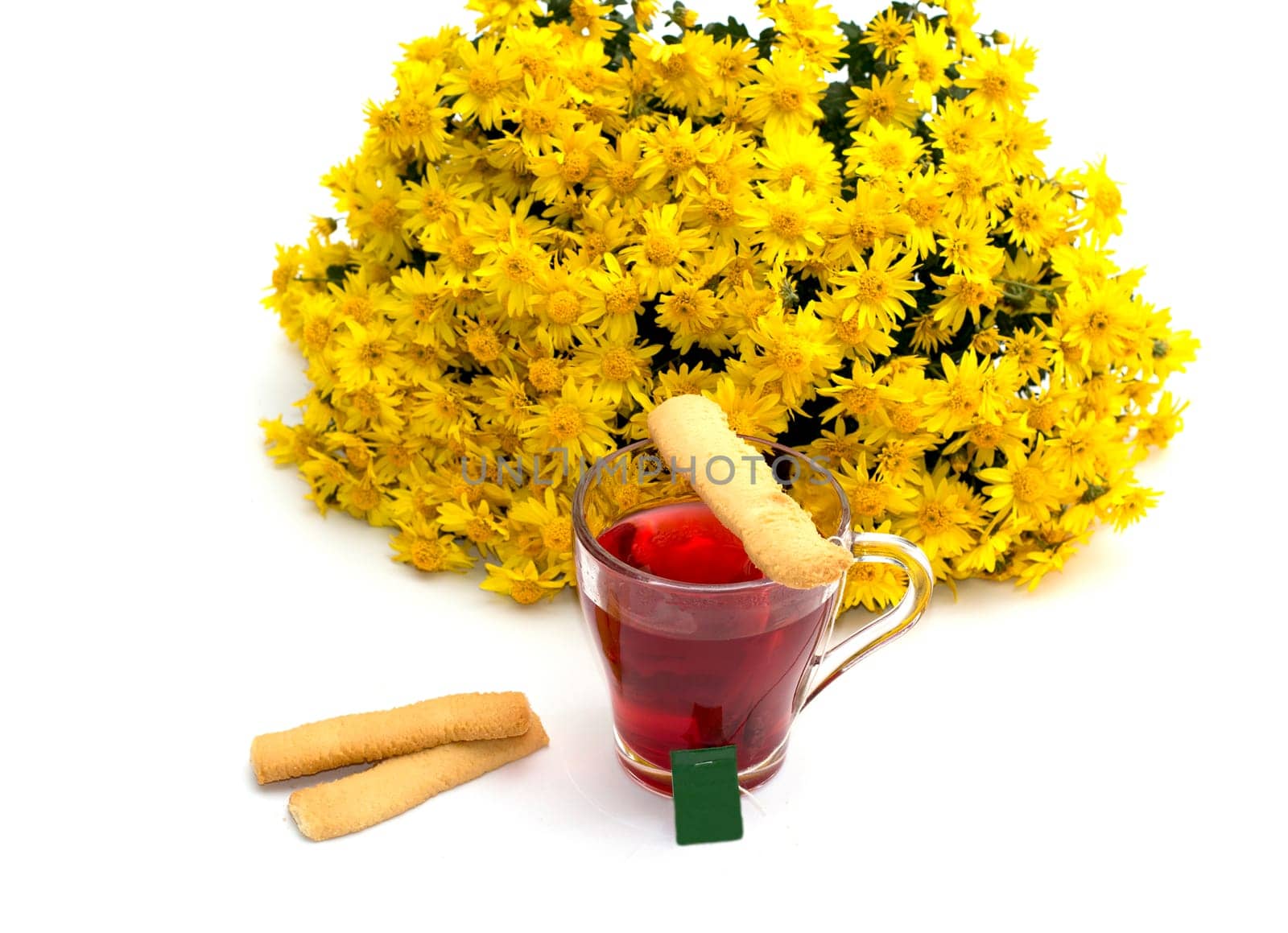 the tea decorated with cookies and a bouquet of yellow flowers on a white background, isolate, a subject fall, food and drinks