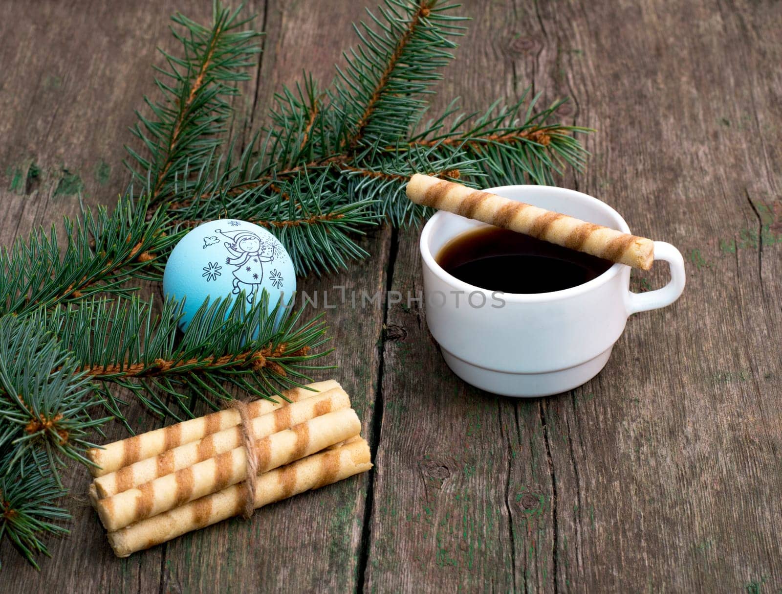 coffee, baking on a cup and nearby and a coniferous branch with scenery, a still life, the subject Christmas and New Year