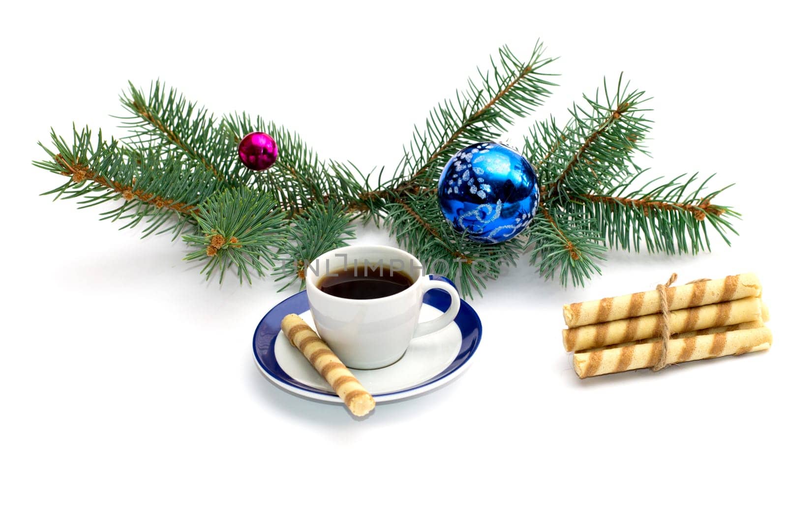 fir-tree branch with ornament, a cup of coffee and a linking of cookies, the subject Christmas and New Year