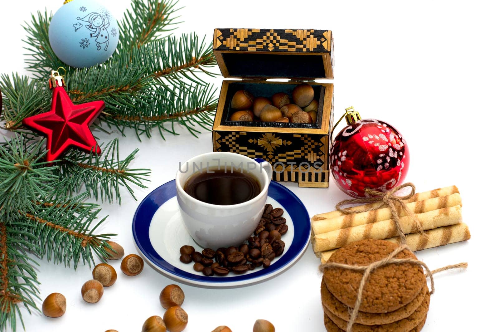 fir-tree branch with ornament, a trunk, sweets and nutlets, the subject Christmas and New Year