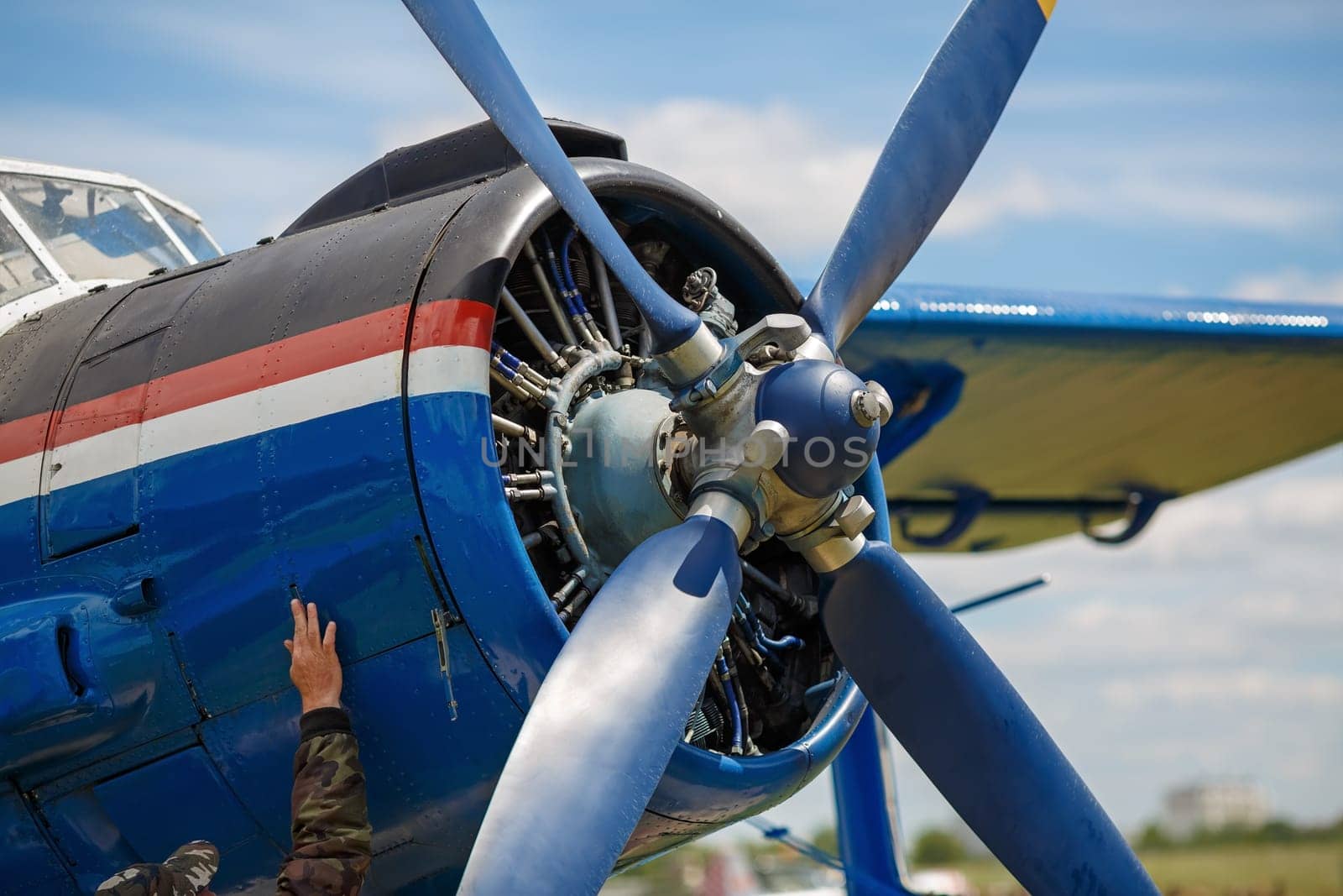 Fragment of an aircraft fuselage with a propeller engine.