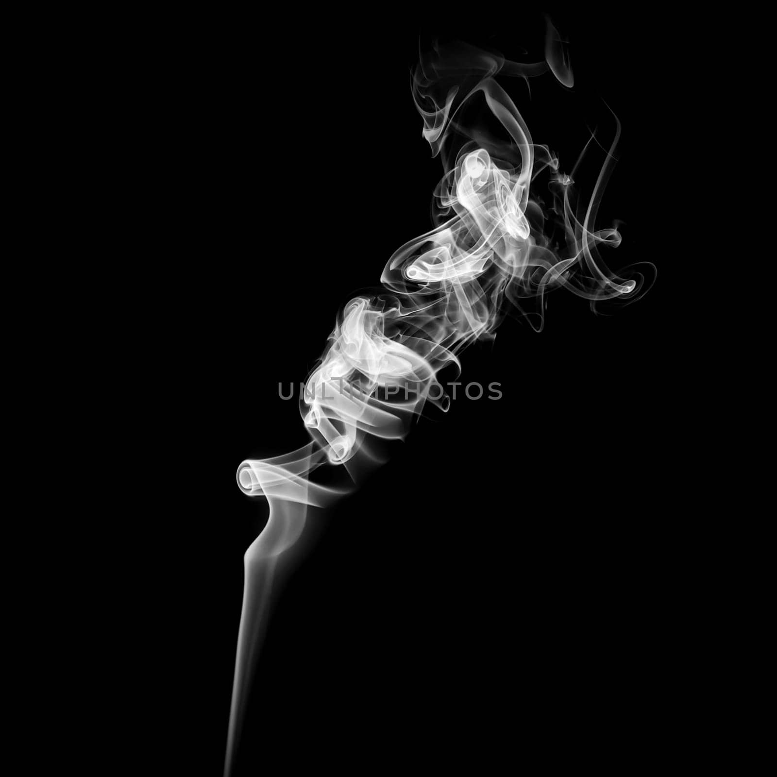 Abstract white smoke swirls on black background