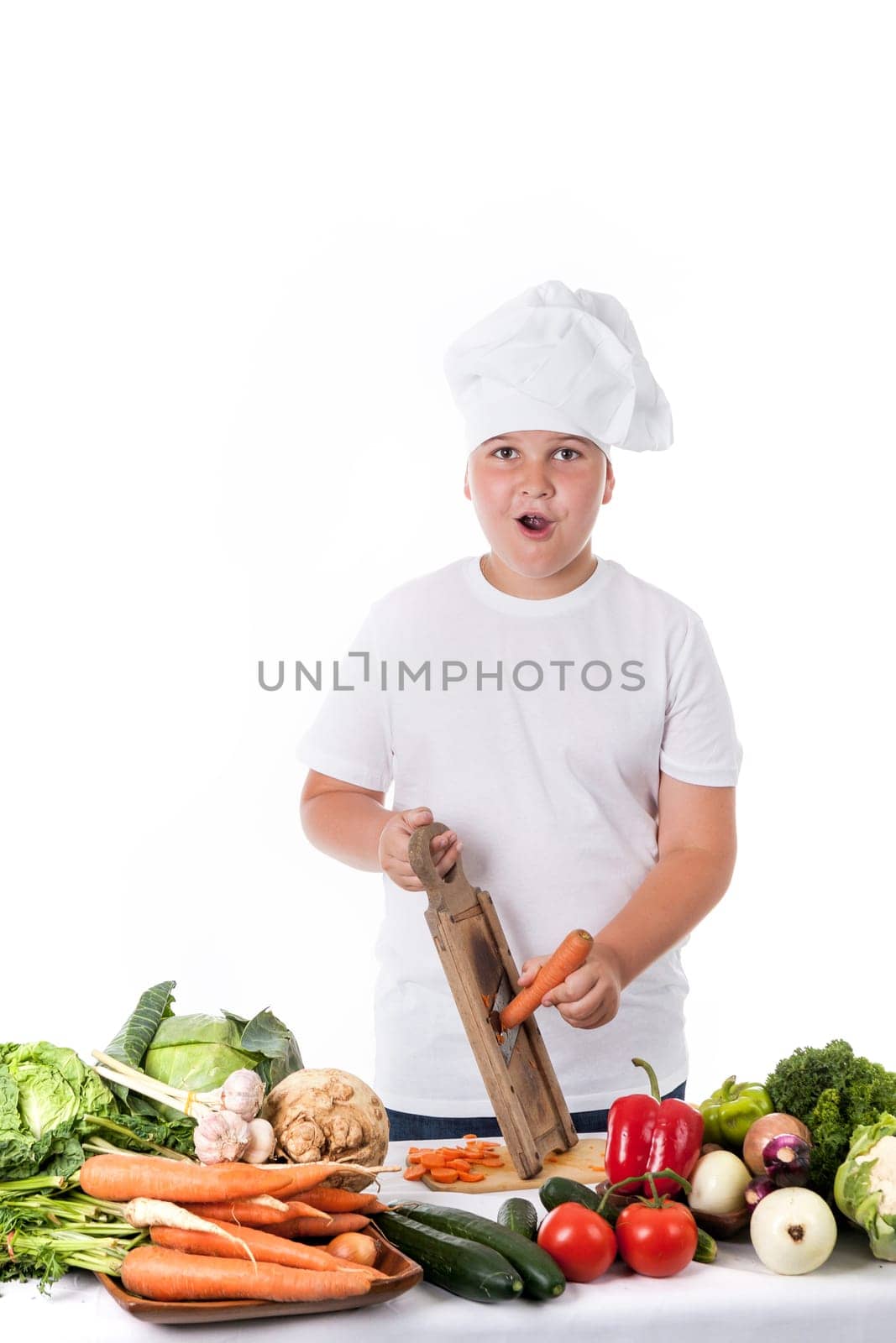 astonished young cook grating carrots