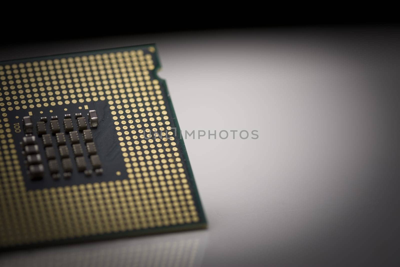 Macro shot of microprocessor with shallow depth of field on grey gradient