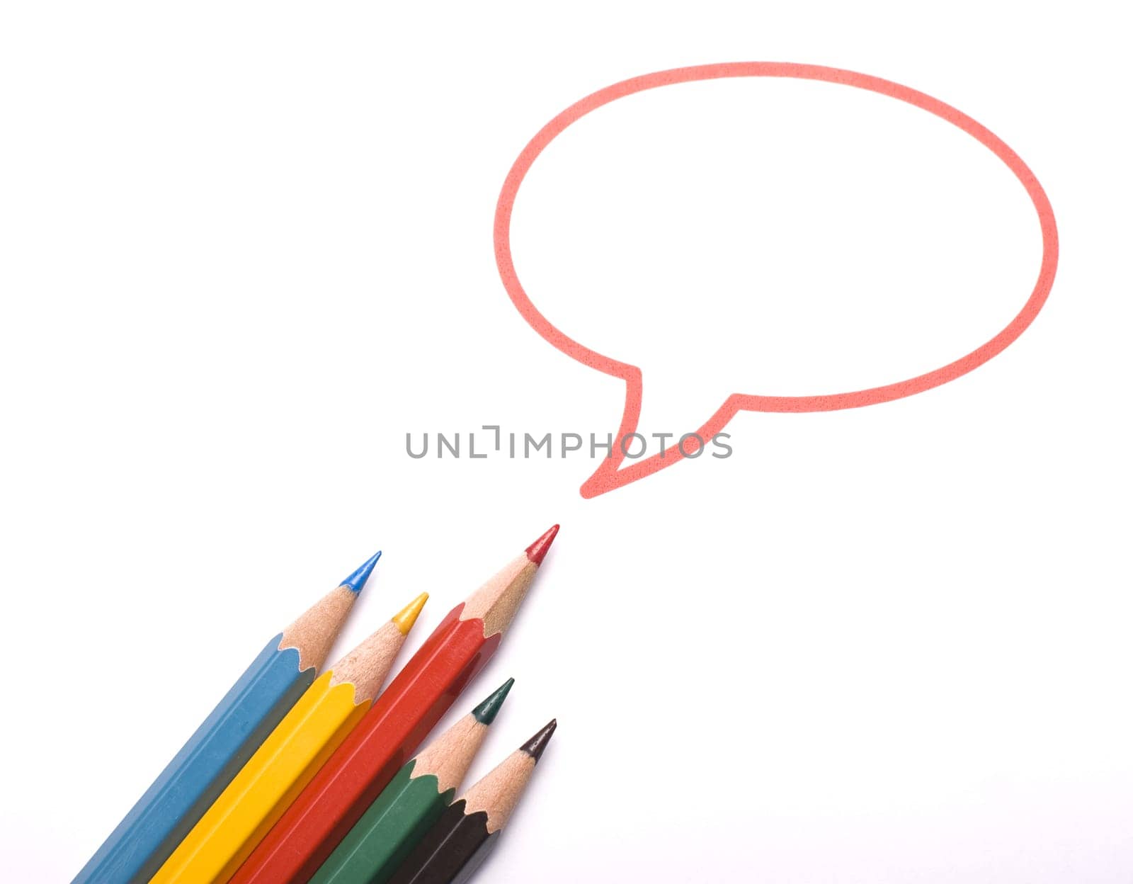 Top view of five colored pencils with the red one having a speech bubble above him. Metaphor for leadership