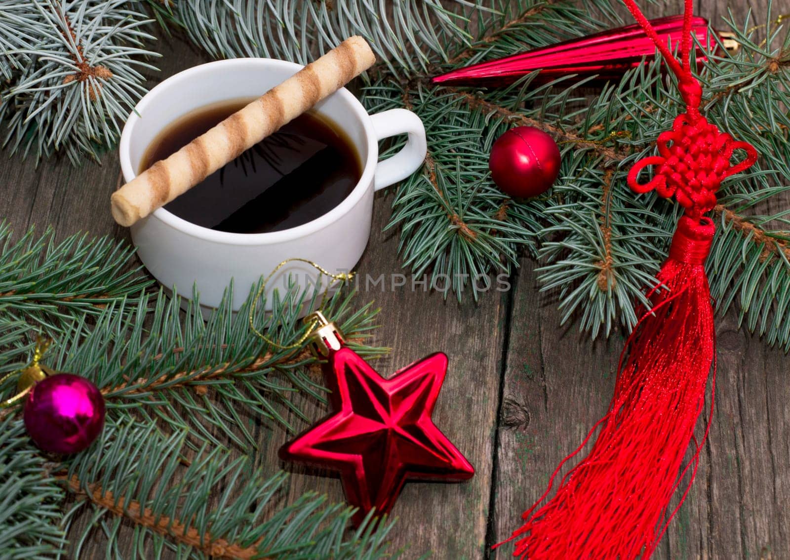 coniferous branch, red star and red tape, still life subject Christmas and New Year