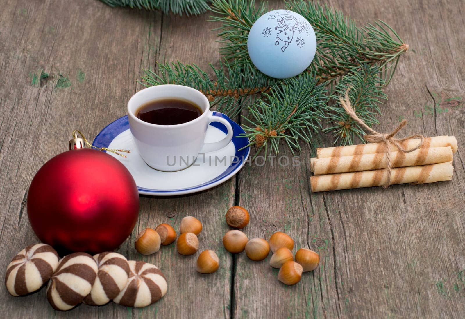 two groups of cookies, coffee, Christmas tree decorations and coniferous branch, still life, subject Christmas and New Year