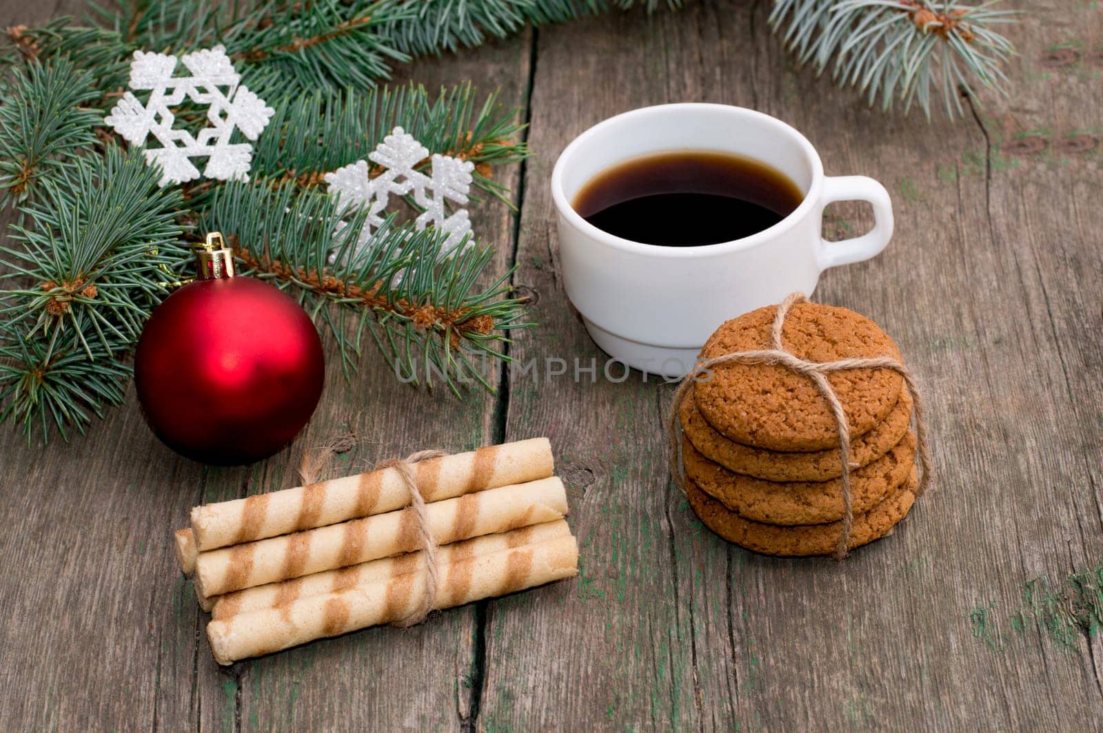 coniferous branch, two linking of cookies and coffee, still life subject Christmas and New Year