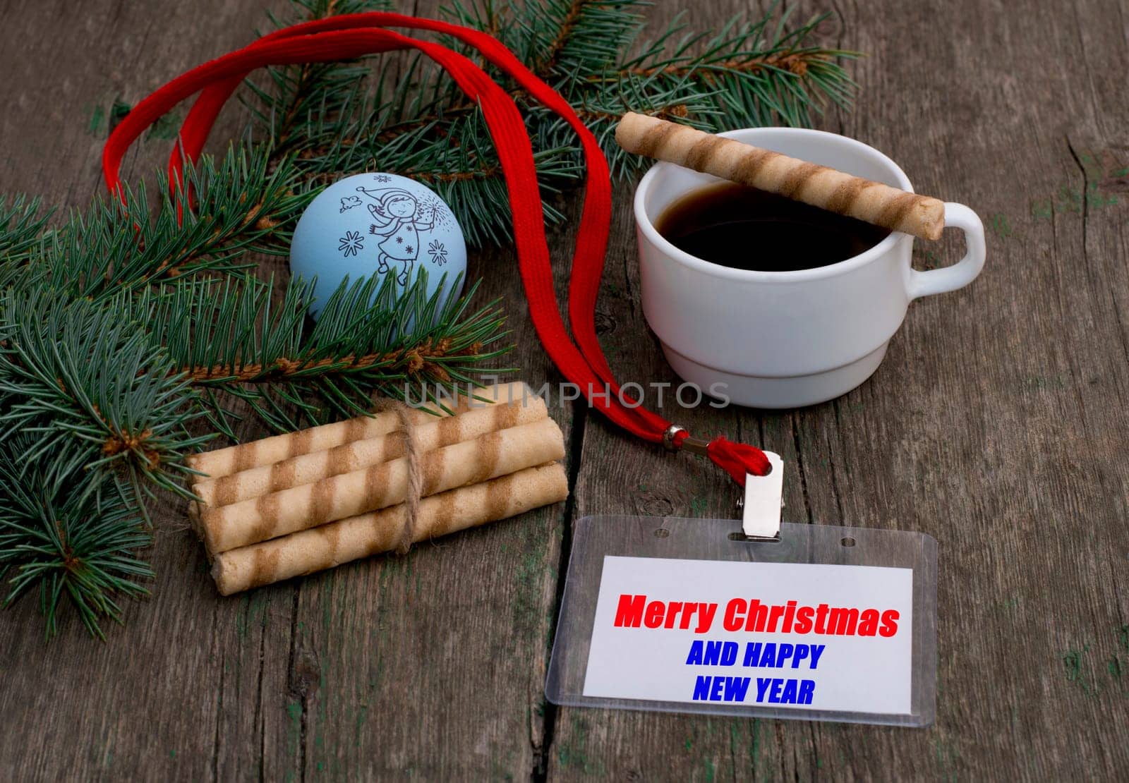 fir-tree branch with Christmas tree decorations, coffee and a label with an inscription Christmas, a subject holidays Christmas and New year