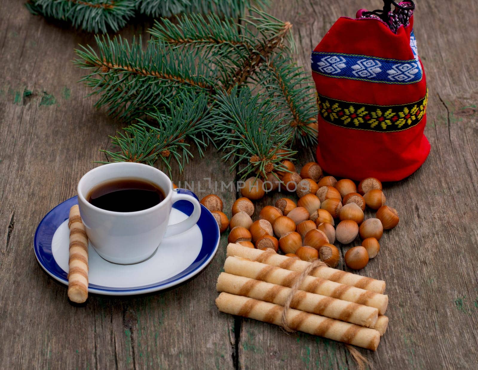 coffee, gift bag, forest nutlets, linking of cookies and fir-tree branch, subject holidays Christmas and New Year