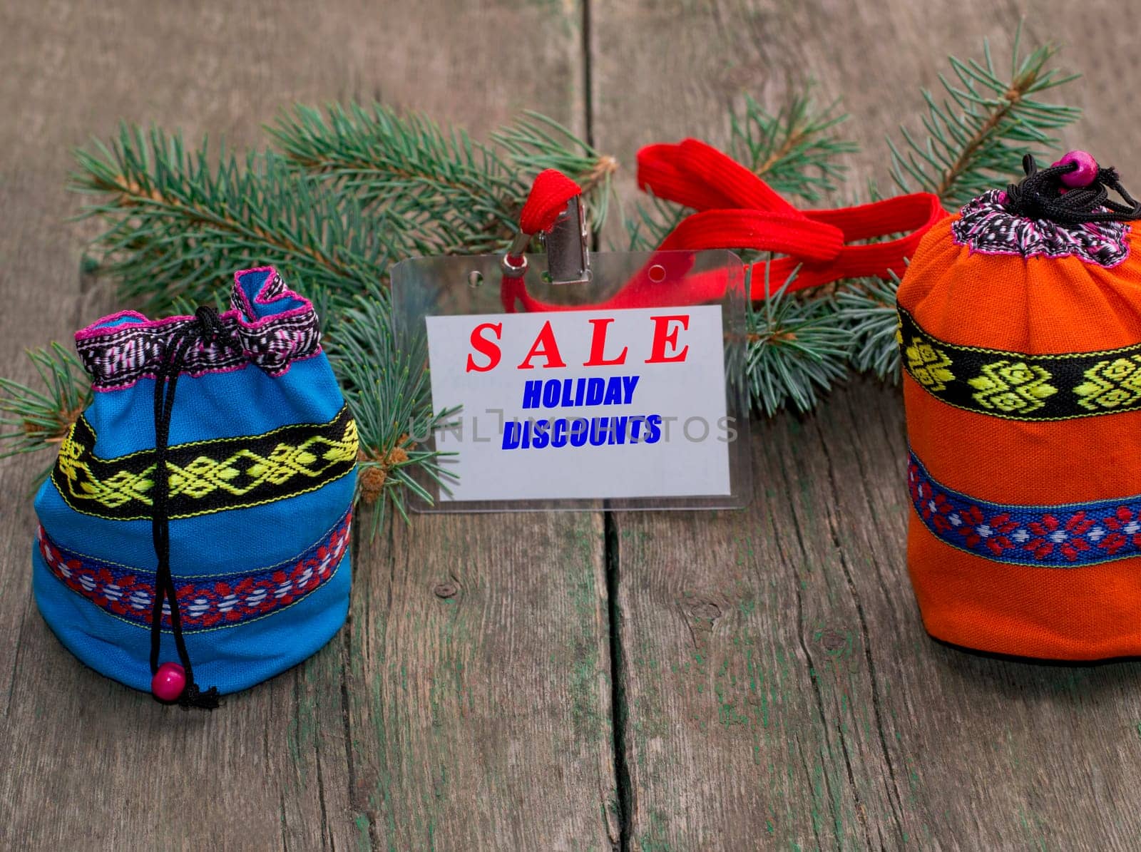 coniferous branch, blue and orange bag, label with an inscription Sale, the subject Christmas and New Year