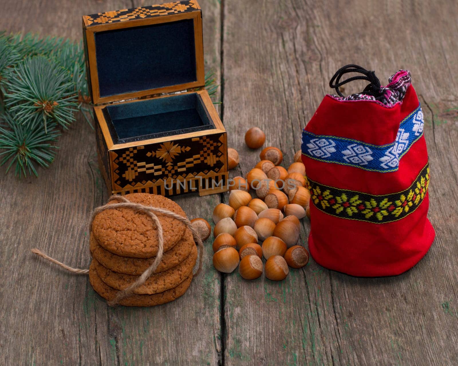 open casket, red gift bag, forest nutlets and linking of cookies, subject holidays Christmas and New Year