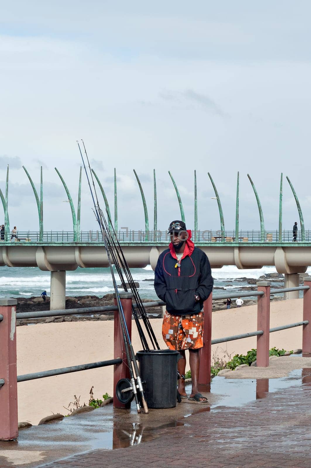 DURBAN, SOUTH AFRICA - JULY 09, 2016: Fisherman at the beach near the Millennium Pier in Umhlanga Rocks