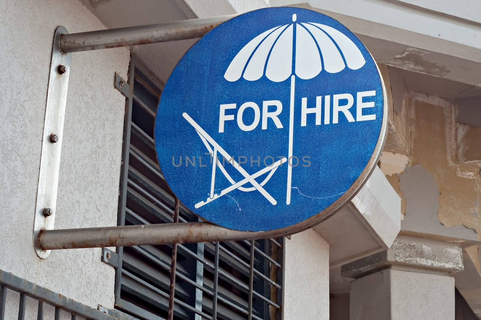Sign advertising beach chairs and umbrellas for hire