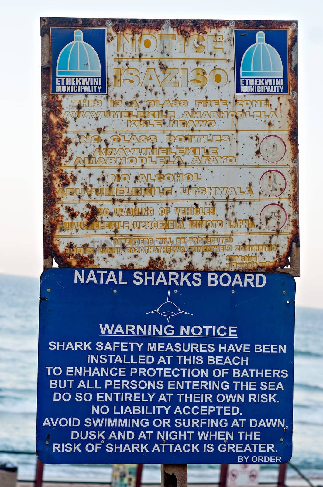 DURBAN, SOUTH AFRICA - JULY 13, 2016: Ethekwini Municipality notice and Natal Sharks Board Warning Notice on the promenade at Umhlanga Rocks