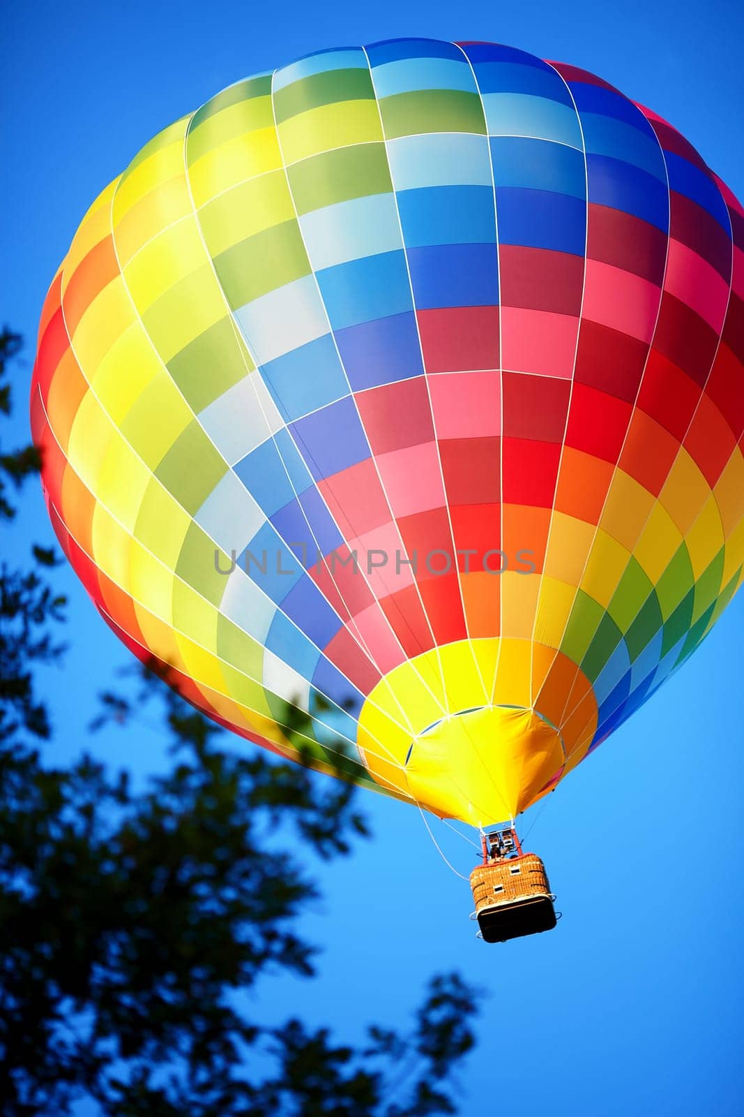 Raznouvetny balloon in clouds. Balloon in the sky. Flight by a balloon.
