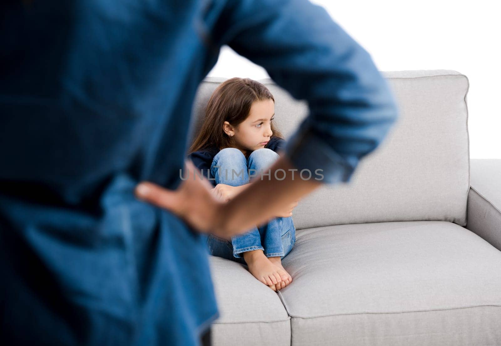 Grown up rebuking a little child for bad behavior