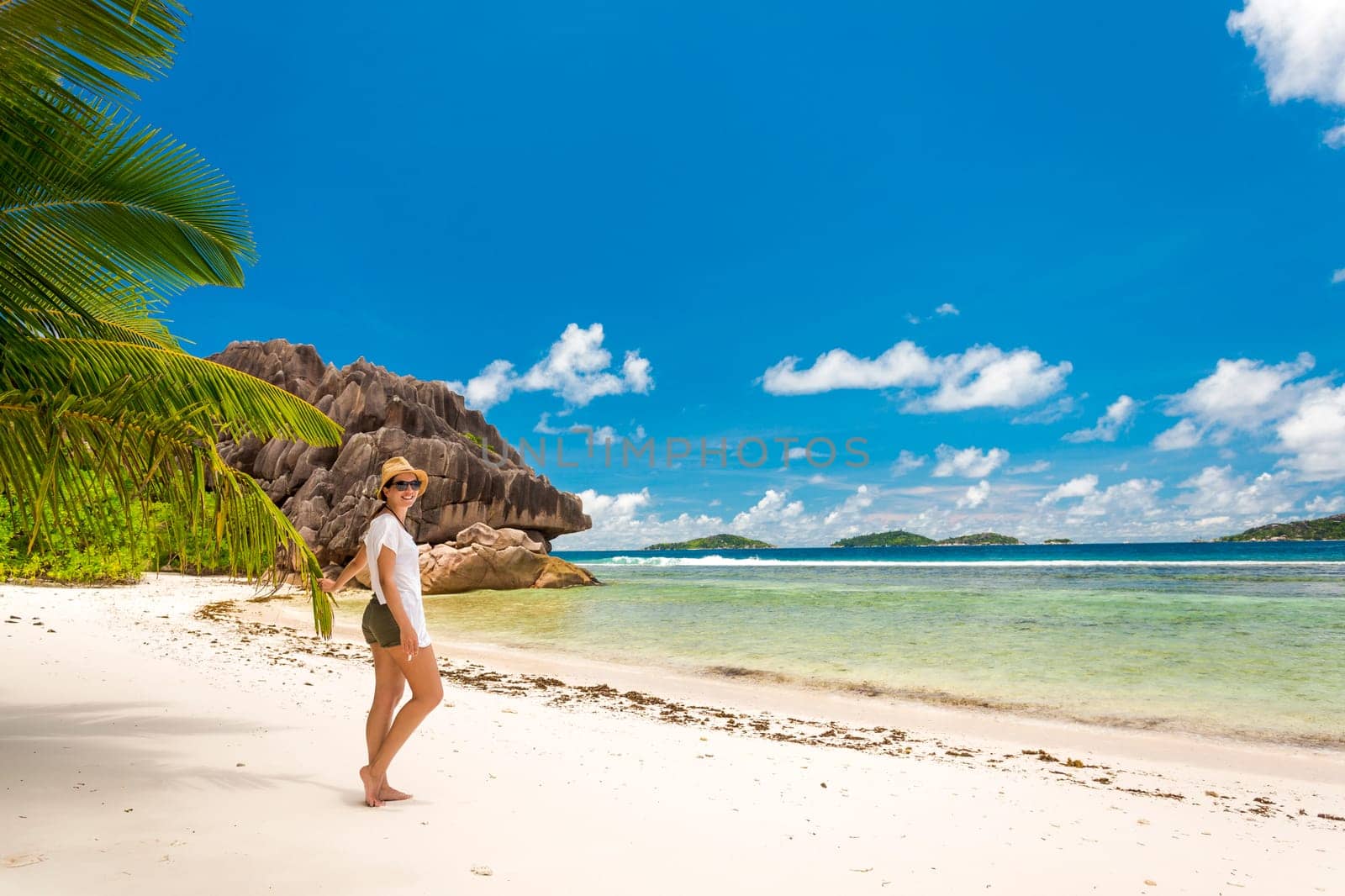 Beautiful woman enjoying the beach in La Digue, Seychelles
