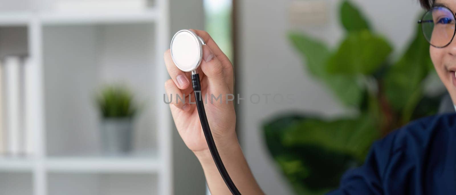 A focused medical student holds a stethoscope, symbolizing readiness and commitment to the healthcare profession.