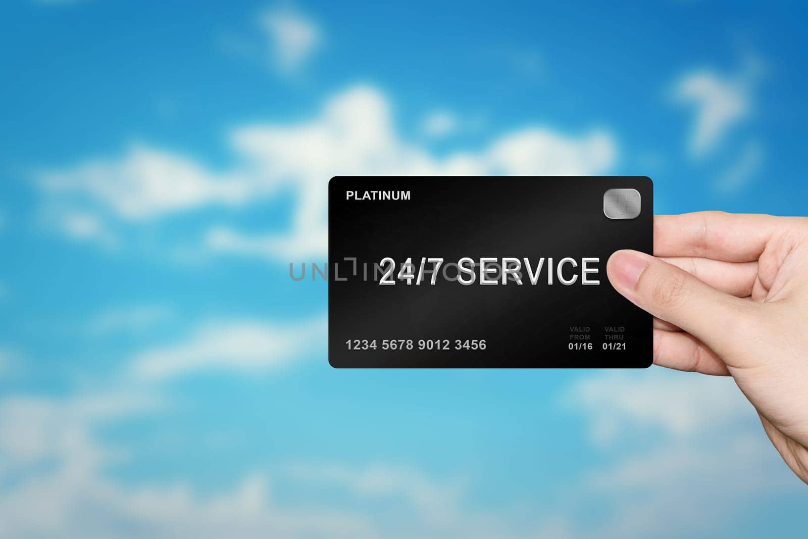 hand picking 24 hours a day, 7 days a week service platinum card on blur background