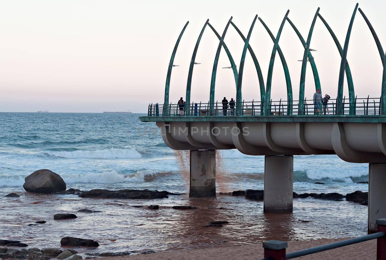 DURBAN, SOUTH AFRICA - JULY 11, 2016: People on the Millennium Pier at the beach in Umhlanga Rocks
