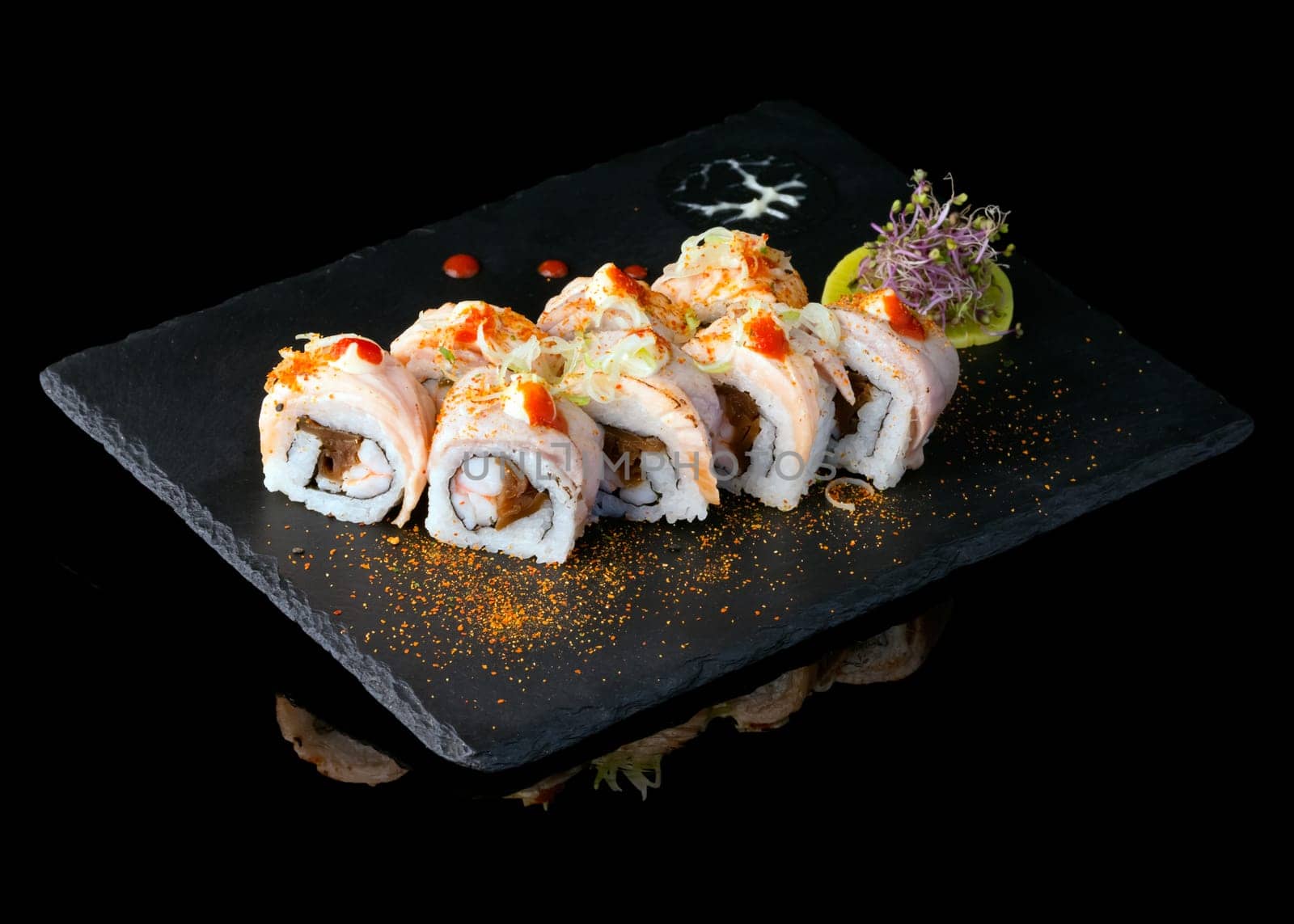 Sushi set over black background