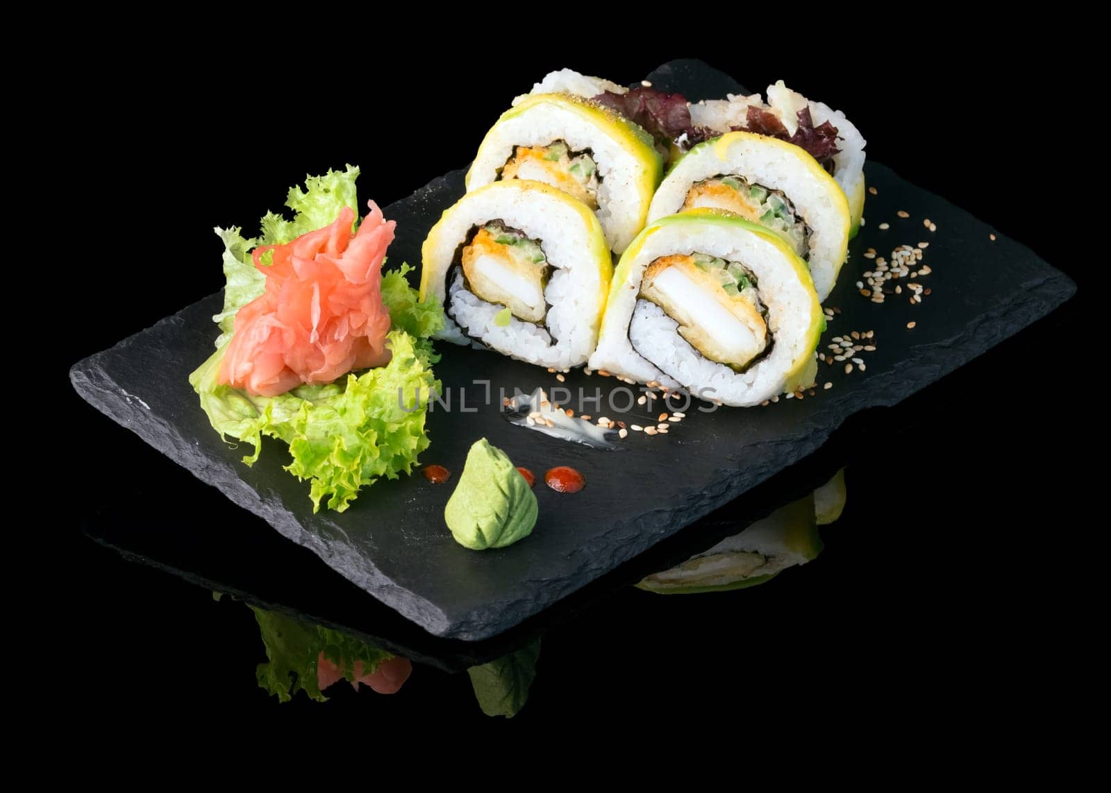 Sushi set over black background