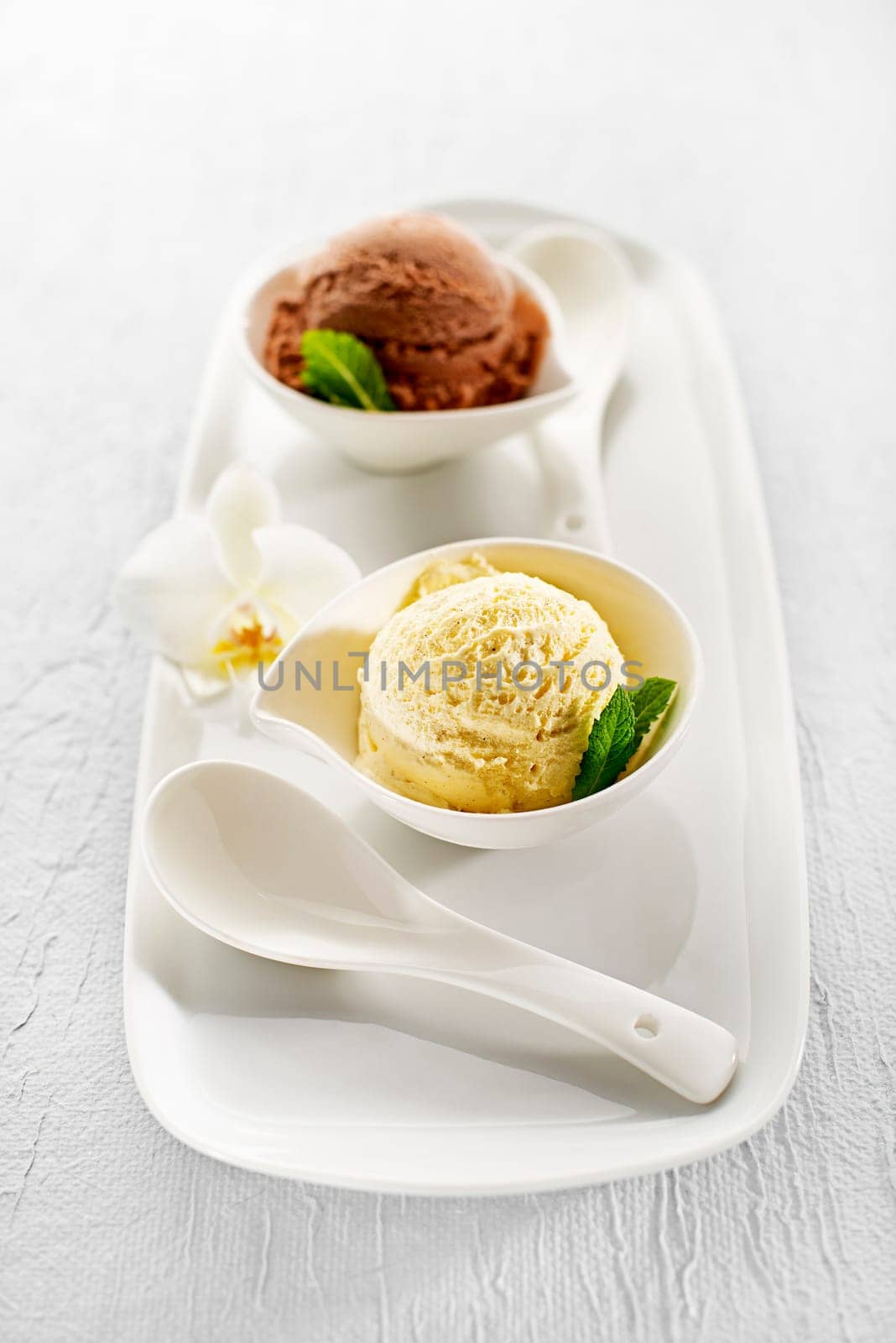 Fresh ice cream in a white bowl close up