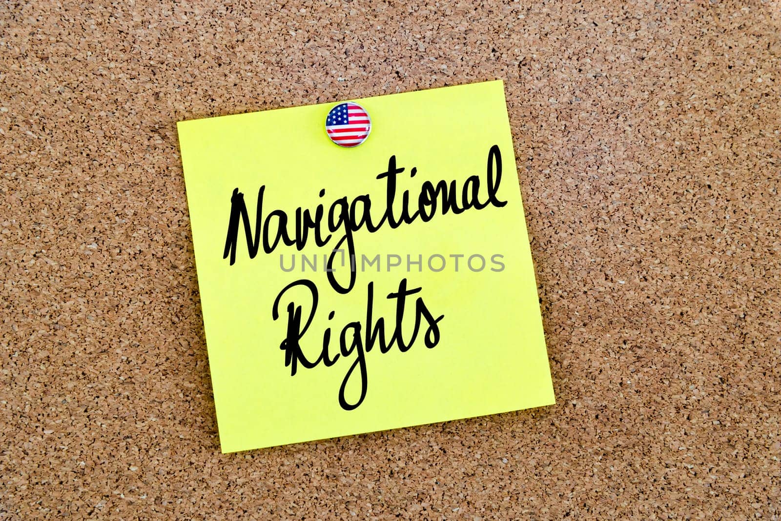 Written text Navigational Rights over yellow paper note pinned on cork board
