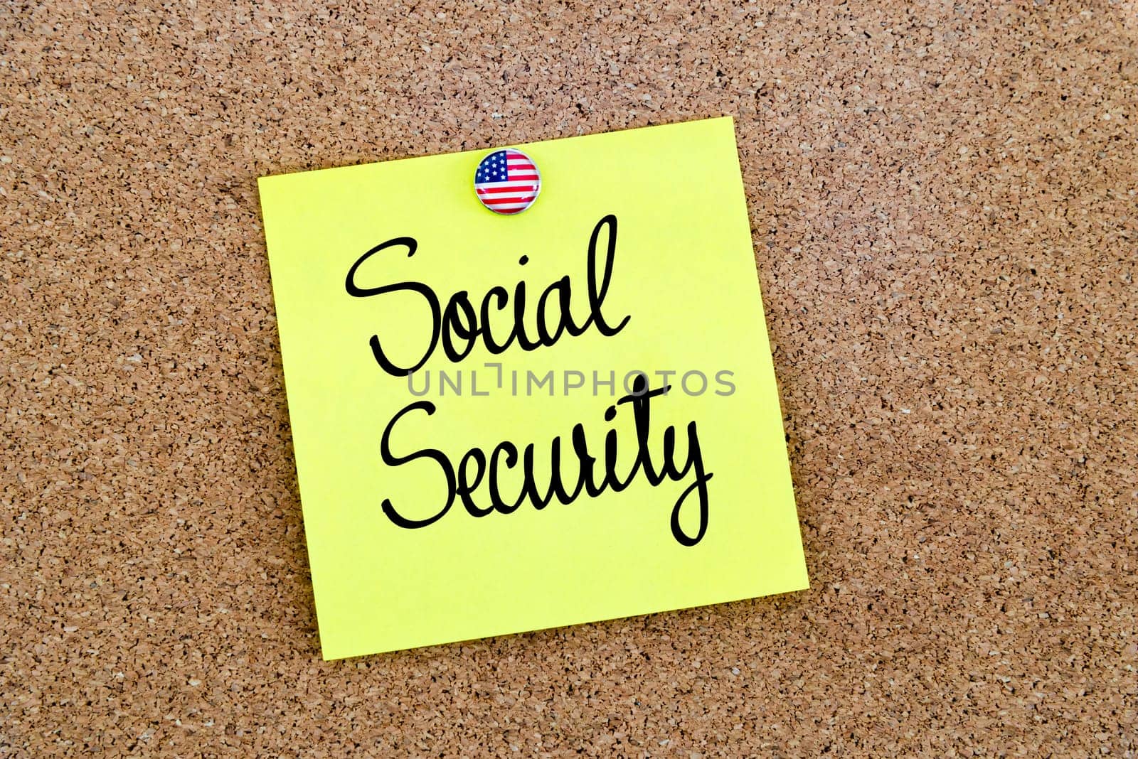 Written text Social Security over yellow paper note pinned on cork board