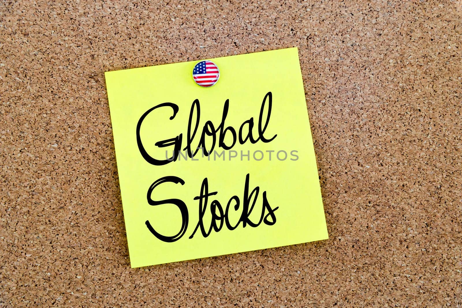 Written text Global Stocks over yellow paper note pinned on cork board