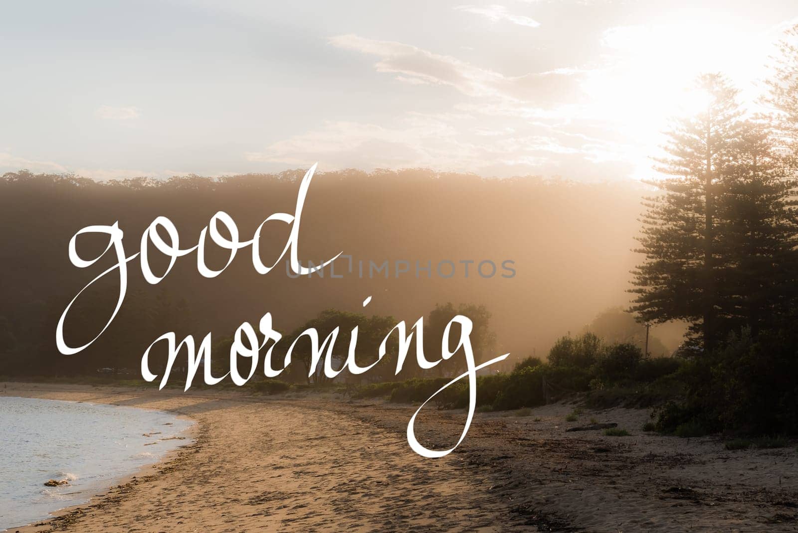 Good Morning Greeting. Handwritten motivational text over sunset calm sunny beach background with vintage filter applied