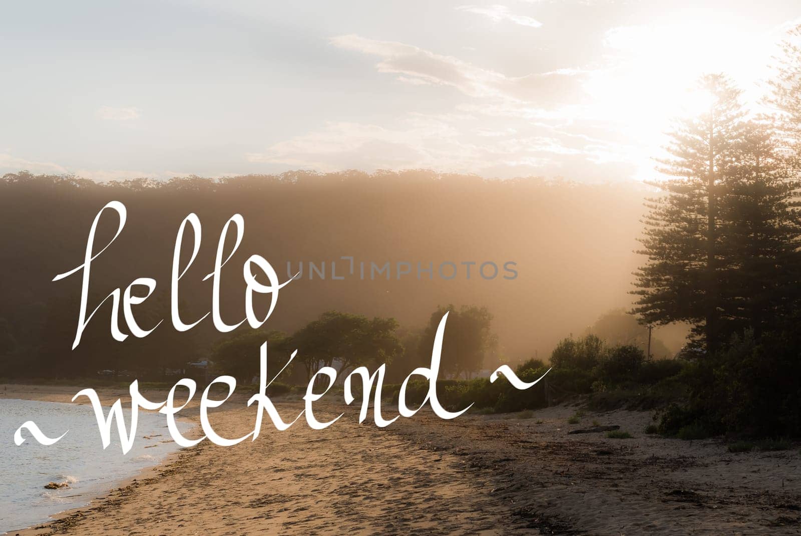 Hello Weekend Greeting. Handwritten motivational text over sunset calm sunny beach background with vintage filter applied