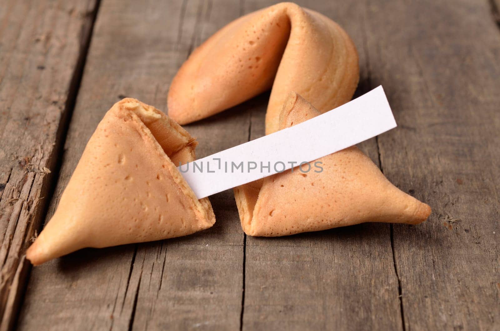 Open fortune cookie with a blank paper inside, space for your text