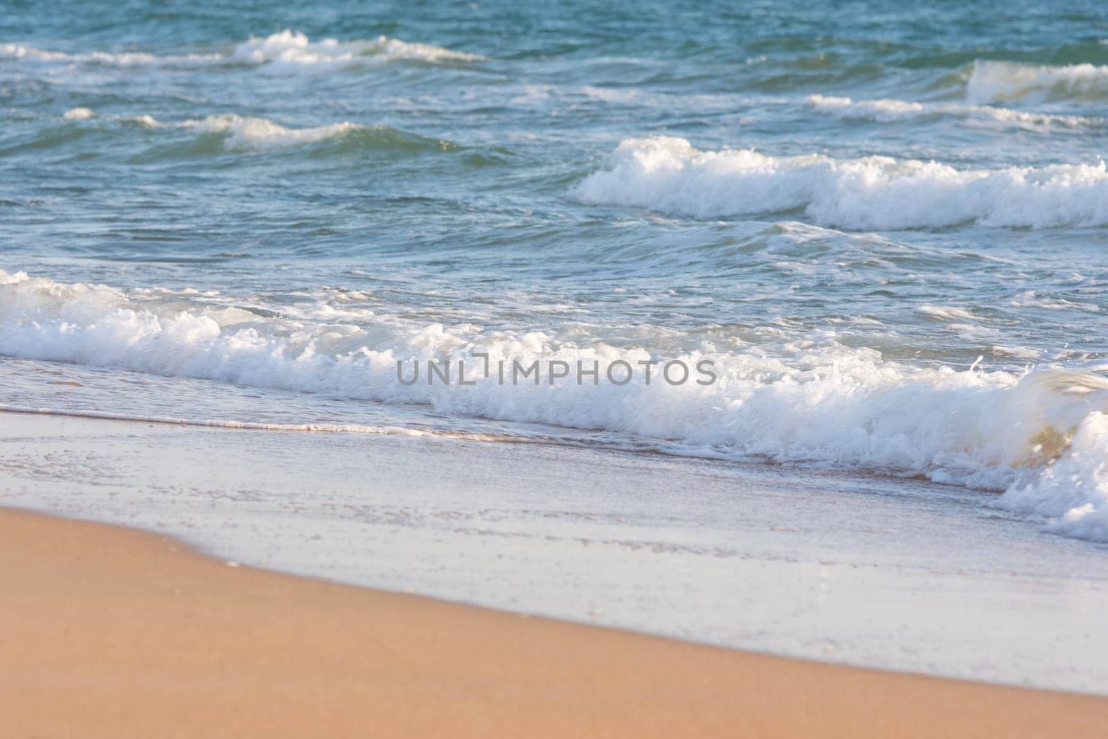 Sea surf on a sandy beach