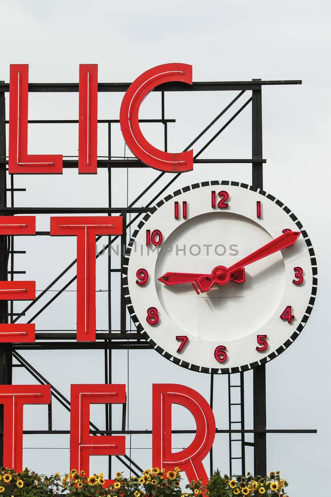 SEATTLE, USA - JULY 29, 2011: Sign and Clock of the Famous Pike Place Market in Seattle, United States.
