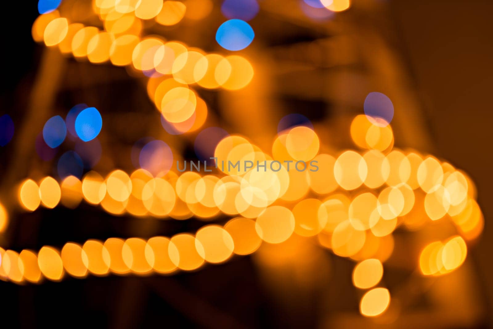 Abstract golden and blue background, circular bokeh, out of focus lights