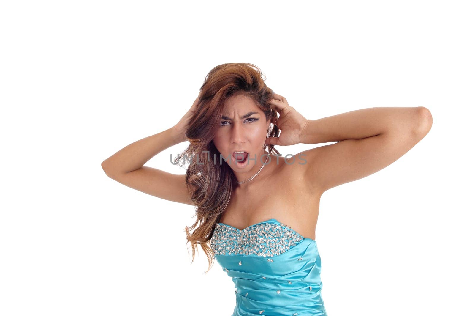 A mad young woman standing in a blue dress and brunette hair in.closeup and screaming, isolated for white background..
