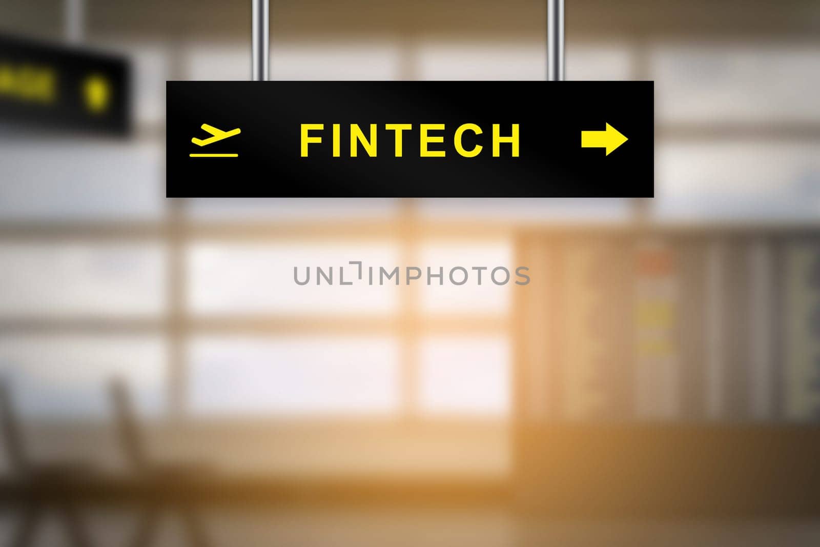 FINTECH or financial technology on airport sign board with blurred background and copy space