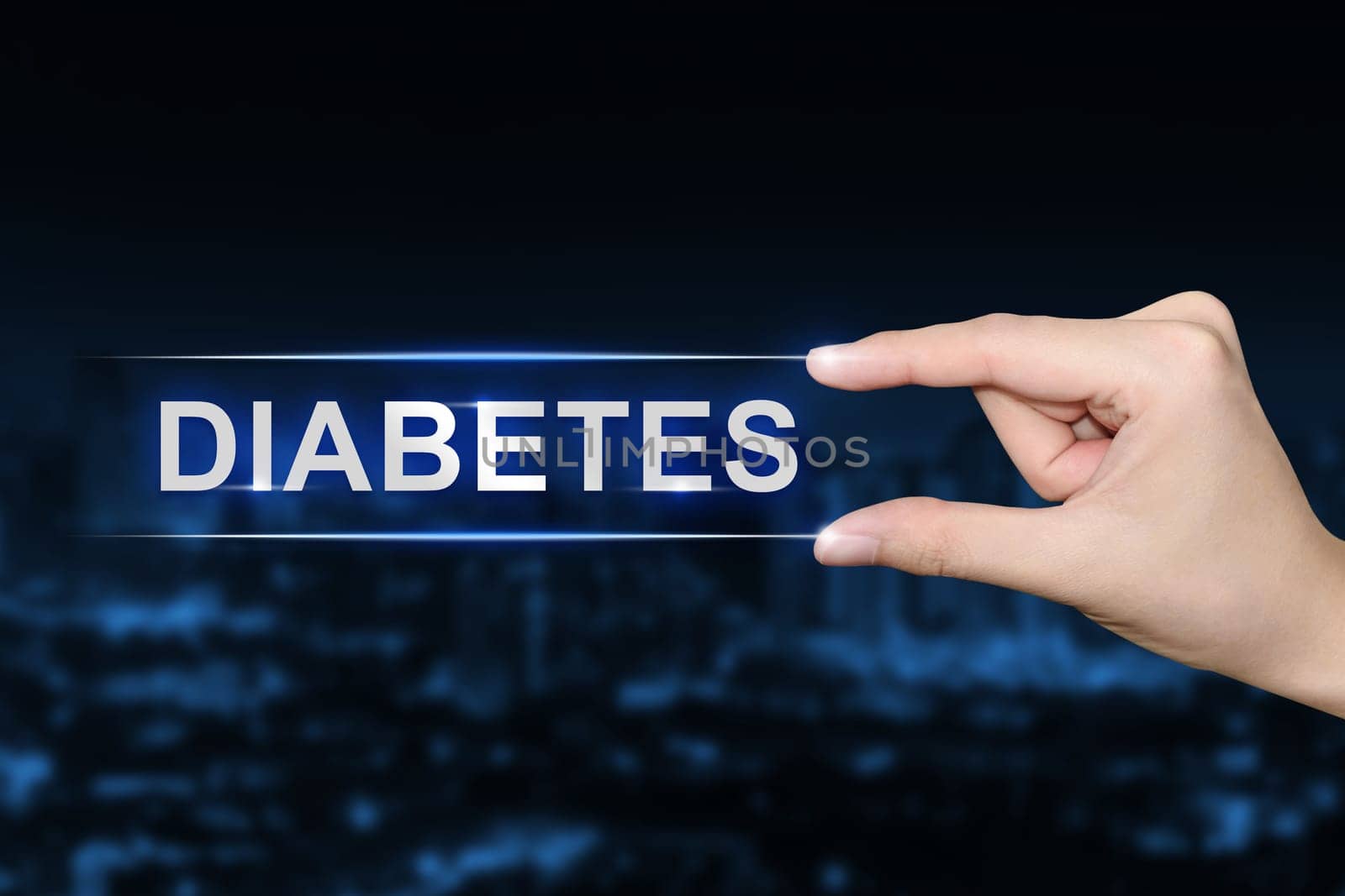 hand pushing diabetes button on blurred blue background