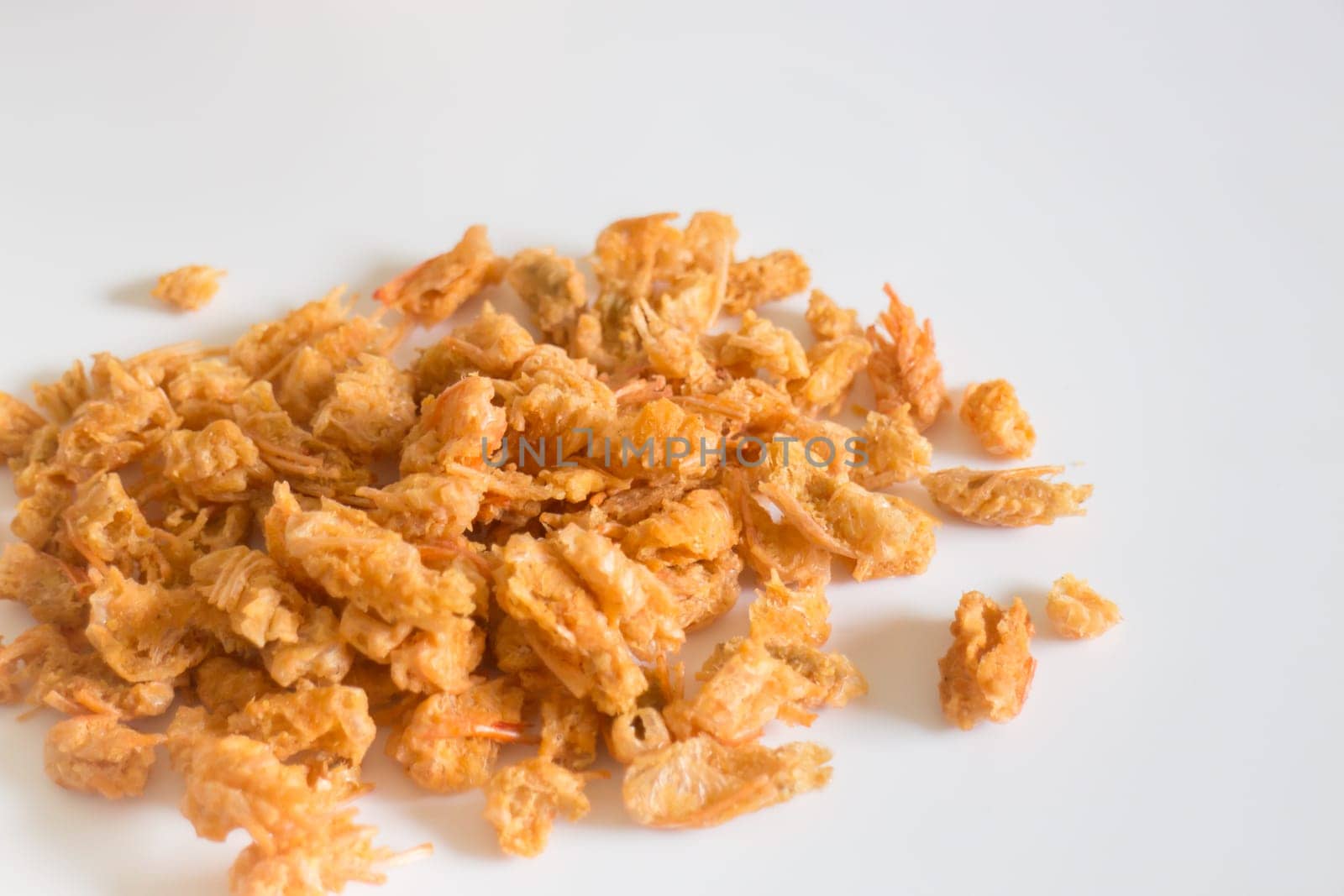 Fried crispy shrimp head on clean background