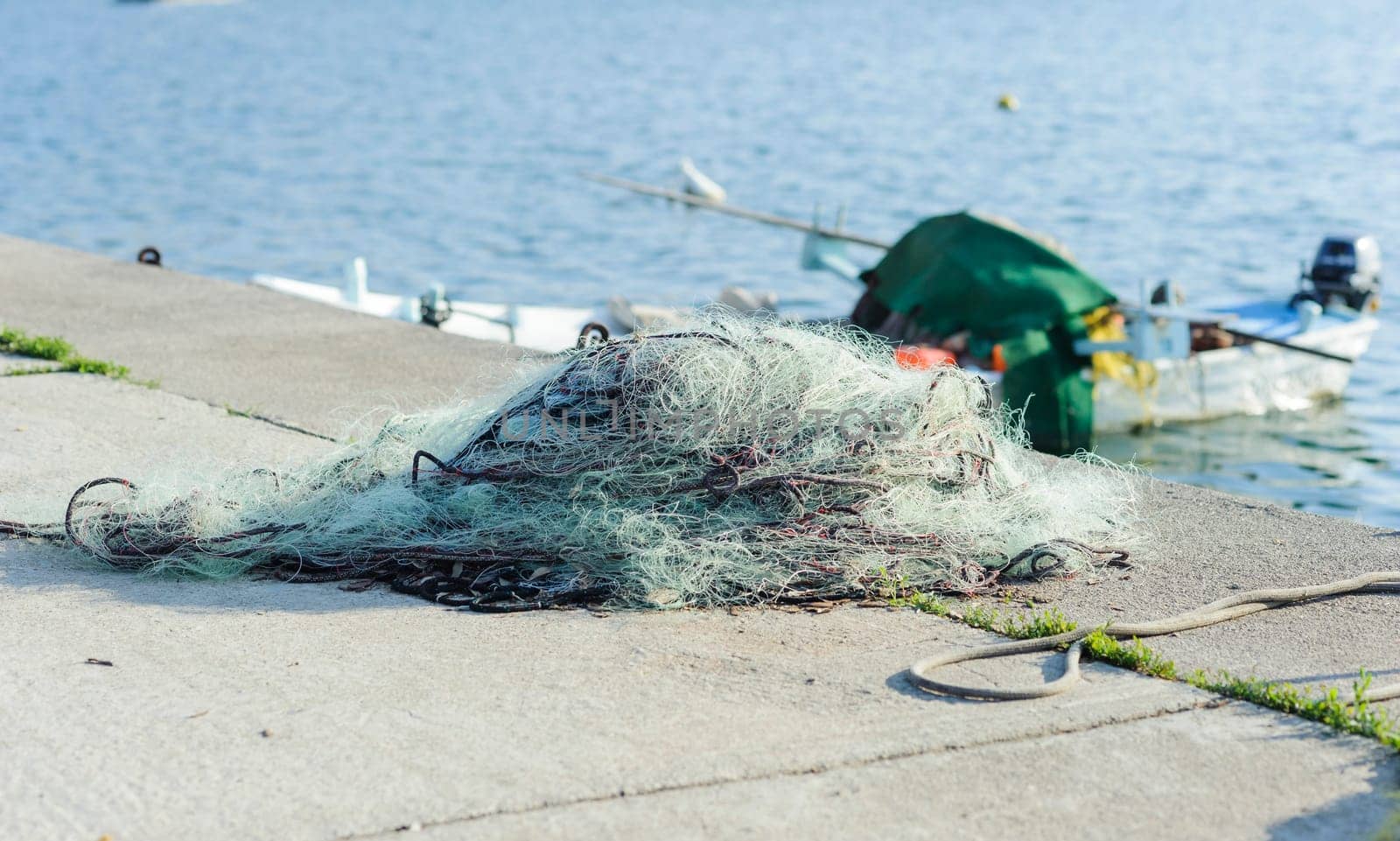 Fishing net to dry on the pier.