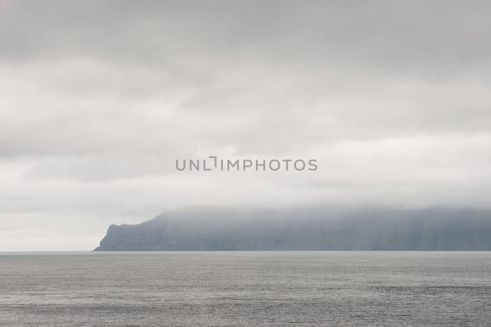 Typical landscape on the Faroe Islands, with water and cliffs